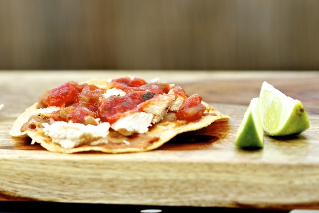 Adding chicken and salsa to the chalupa