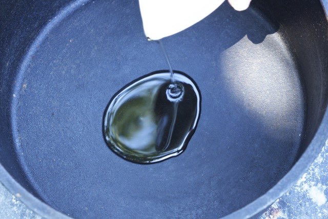 Adding oil to Dutch oven | Cooking-Outdoors.com | Gary House