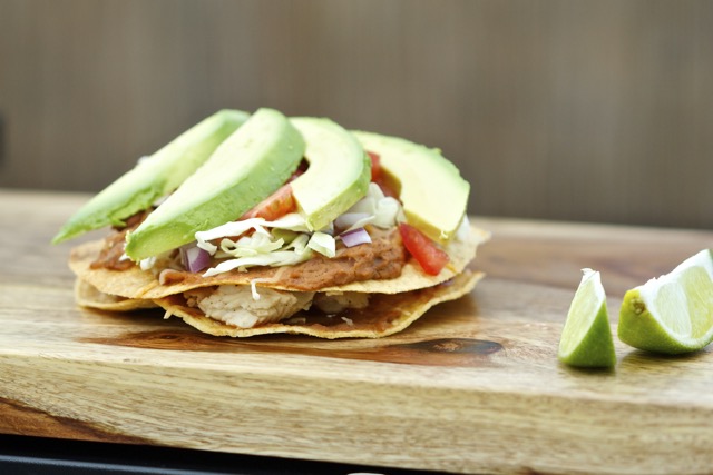 Adding the avocado to the chalupa