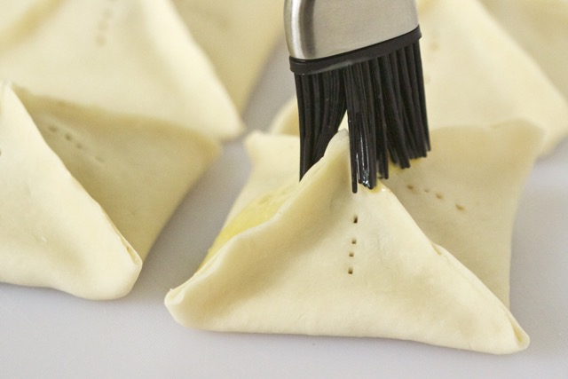 Brushing egg wash on grilled peach dumplings | Cooking-Outdoors.com | Gary House