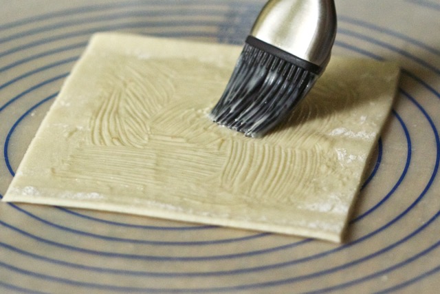 Brushing melted butter on pie dough | Cooking-Outdoors.com | Gary House