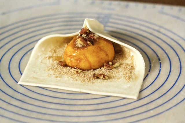 Enclosing grilled peach with the pie dough | Cooking-Outdoors.com | Gary House