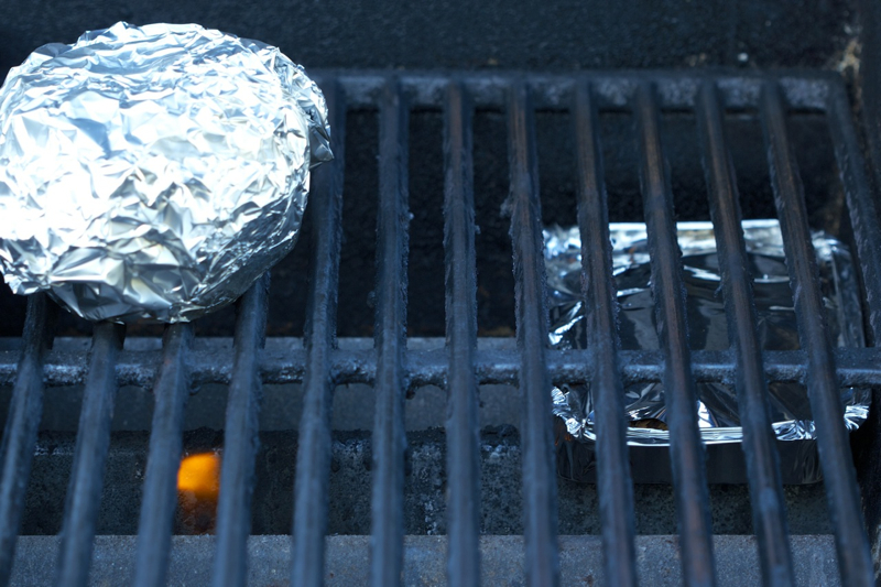 Mesquite woods chips under the grate on a gas grill