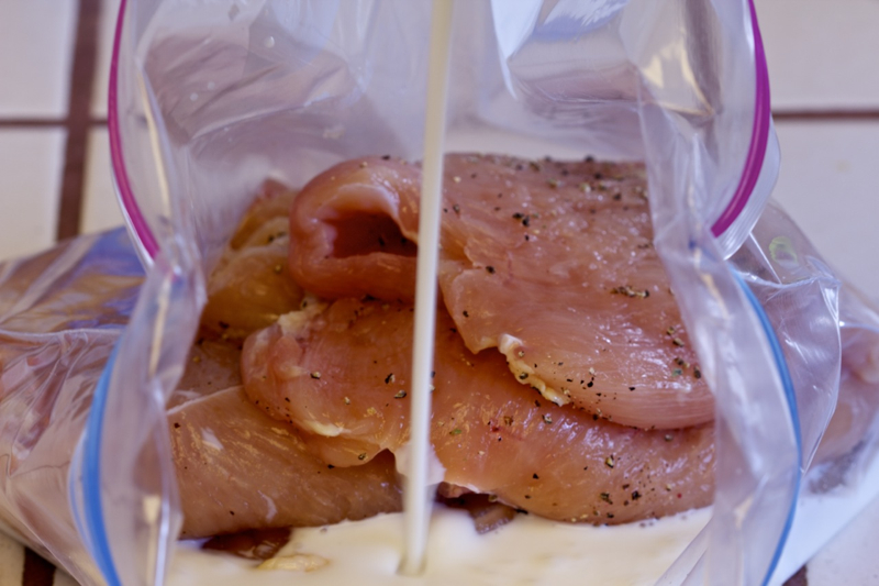 Adding marinade to the Orange-Olive Chicken Scaloppine Recipe