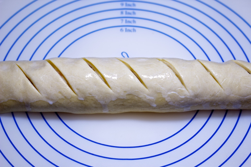 Parmesan & Proscuitto Loaf slashed and coated with milk