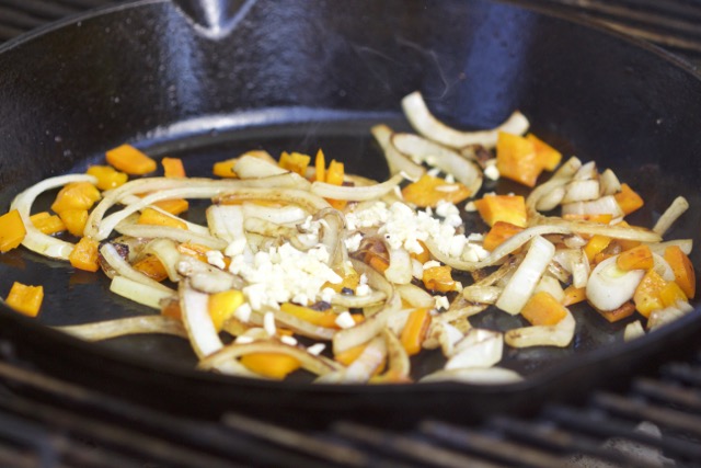 Sweating onions, bell peppers and garlic